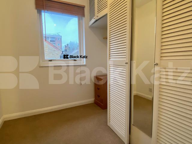 Two bedroomed house with study room, conservatory, parking & charming garden   Kinburn Street, Rotherhithe/Canada Water. 